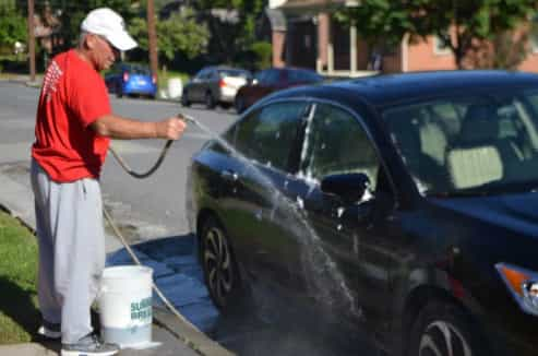 rinsing the car